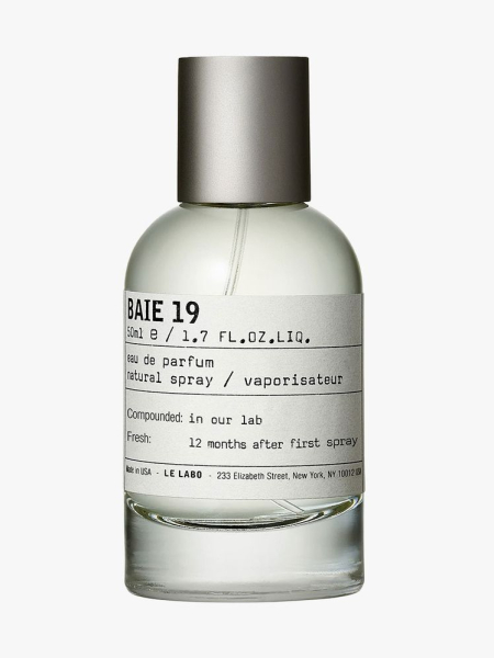 Clear bottle of Le Labo BAIE 19 Eau de Parfum with silver cap on light gray background