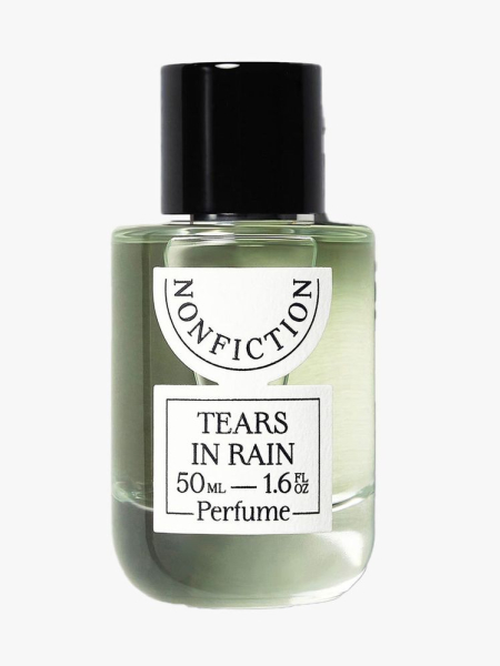 Clear bottle of Nonfiction Tears in Rain Eau de Parfum with black cap on light gray background